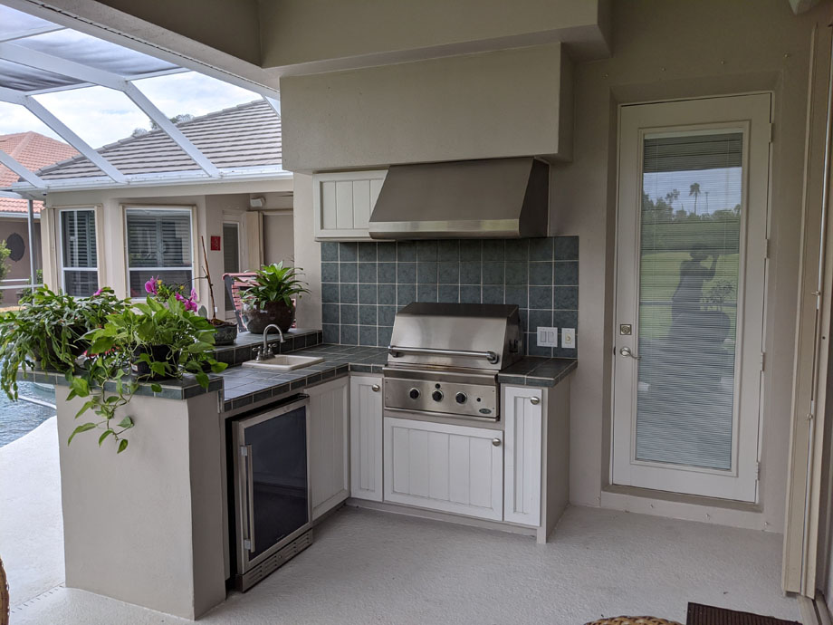 before shot of "Huot Outdoor Kitchen" with beige walls and gray tiled backsplash